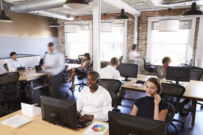 View of staff in busy customer service department